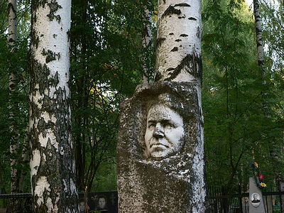 Grave monument. The birches are its peers.
